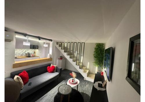 Modern and warm studio with designer staircase