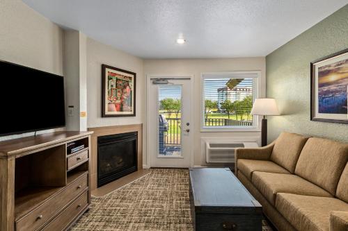a living room with a couch and a flat screen tv at WorldMark Grand Lake in Monkey Island