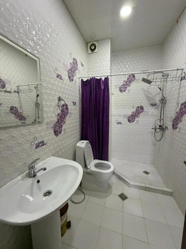 a bathroom with a sink and a toilet at City View Apartments At Dadiani St in Tbilisi City