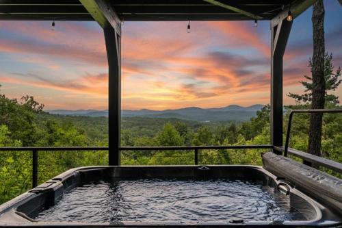 a hot tub with a view of the mountains at Top of the Mountain Breathtaking Views Hot Tub in Blue Ridge