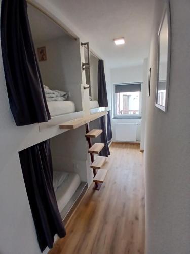 a room with a bunk bed and a mirror at CUBE 5 New in Bad Saulgau