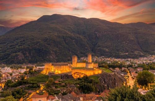an aerial view of a castle on a mountain at The Queens House in Bellinzona