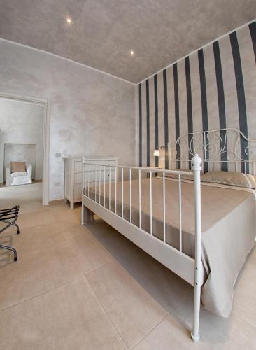 Ένα ή περισσότερα κρεβάτια σε δωμάτιο στο Relais La Pretura
