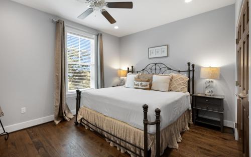 a bedroom with a bed and a window at Deja Blue by Oversee 30A in Santa Rosa Beach