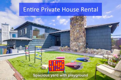a house with a playground in the yard at Entire Private Home with 3 Bedrooms 2 Bathrooms, Gated Yard, 100 inch TV, 1 Gbps WiFi, Available Now in San Diego