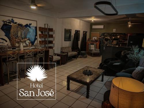 a living room filled with furniture and a table at Hotel San José in San José del Cabo