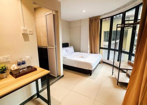 a hotel room with a bed and a window at Swing & Pillows - Sentul Jalan Ipoh Kuala Lumpur in Kuala Lumpur