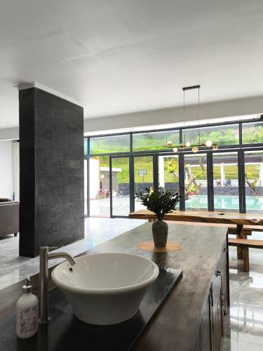 a bathroom with a sink on top of a counter at Stella Di Mare Puncak with Private Pool 5 Bedrooms in Sampal 2