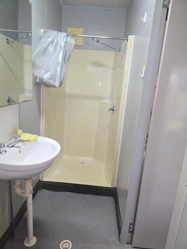 a bathroom with a shower and a sink at Cheap Rooms North Brisbane in Narangba