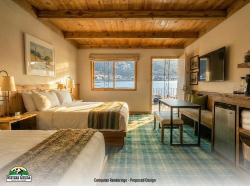 a hotel room with two beds and a table at Western Riviera Lakeside Lodging in Grand Lake