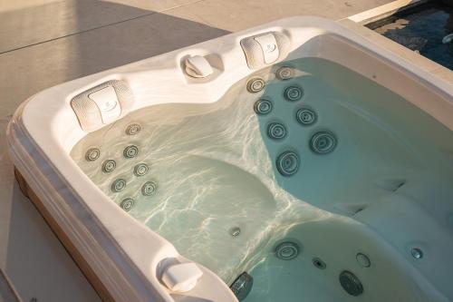 a jacuzzi tub with water in it at GkF Luxury Villas in Naxos Chora