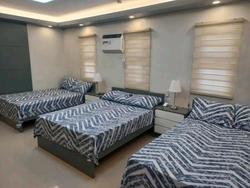 a room with three beds in a room at Beachfront With 2 Bedrooms and Pool for 20 in San Juan