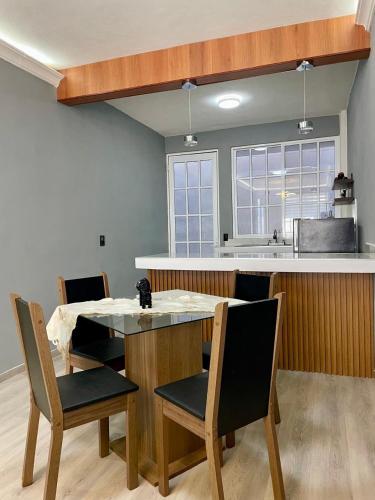 a kitchen with a dining room table and chairs at Moderno departamento en Tula in Tula de Allende