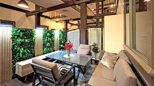 a living room with a table and a couch and a table sidx sidx at Luxe suite in Darling Harbour with pool, sauna & gym - ICC 300m in Sydney