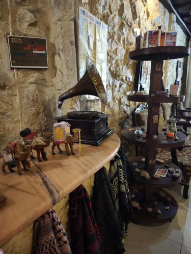 a room with a counter with a stove and a shelf at Rocky Mountain Hotel Jordan in Petra