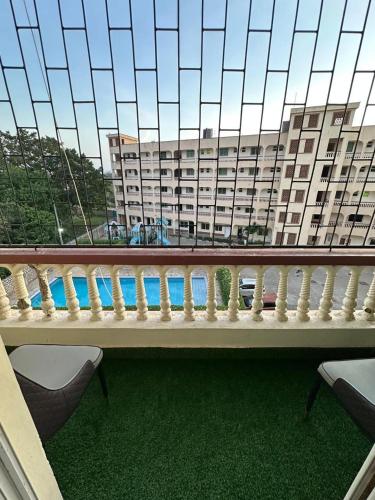 a balcony with a view of a large building at SaltyNest in Gatunga