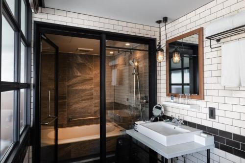a bathroom with a sink and a shower at Four Points by Sheraton Nagoya, Chubu International Airport in Tokoname