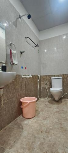 a bathroom with a sink and a toilet at Royal Green Residency Chennai Airport in Chennai