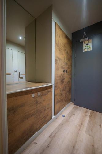 a bathroom with a sink and a large mirror at Hotel Saint-Hubert in Hambach
