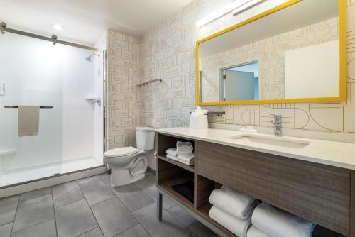 a bathroom with a sink and a shower and a toilet at Home2 Suites By Hilton New Braunfels in New Braunfels