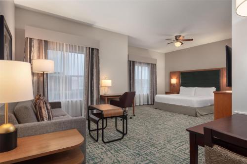 a hotel room with a bed and a desk at Homewood Suites TechRidge Parmer @ I-35 in Austin