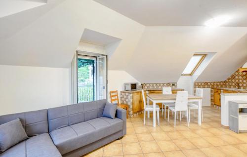 a living room with a couch and a table at 2 Bedroom Cozy Apartment In Uscio in Uscio