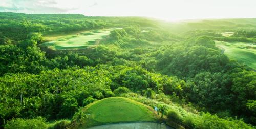 an aerial view of a golf course in the hills at LeoPalace Resort Guam in Yona