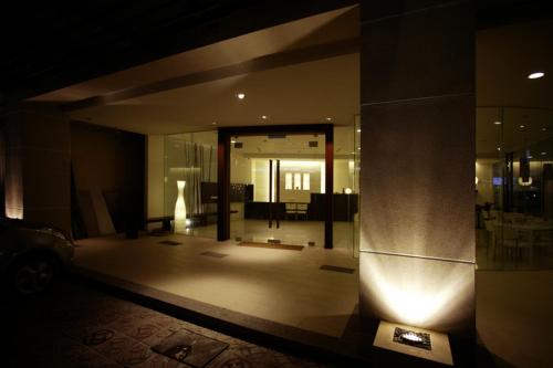 a lobby of a building at night with a car at River Hotel in Chiayi City