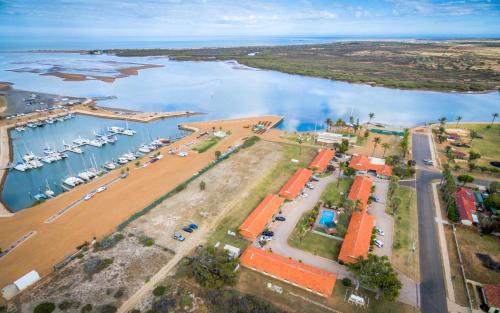 an aerial view of a marina with boats in the water at Hospitality Carnarvon, SureStay by Best Western in Carnarvon