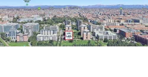 an aerial view of a city with tall buildings at Olympic Lodge in Milan