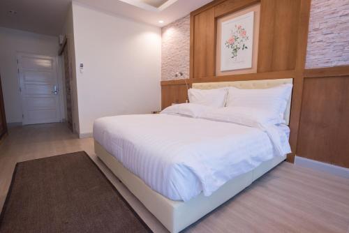 Postel nebo postele na pokoji v ubytování Triple B Boutique Residence
