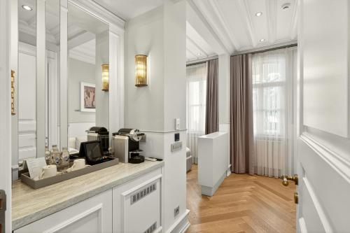 a white room with a hair dryer on a counter at Arbor Hotel - Signature Collection in Istanbul