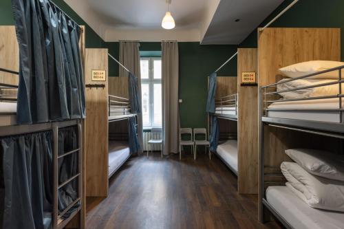 a room with bunk beds in a hostel at WOW Hostel in Krakow