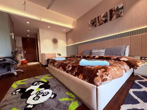 a bedroom with a large bed in a room at Luxury Couple Friendly Studio in Dehradun