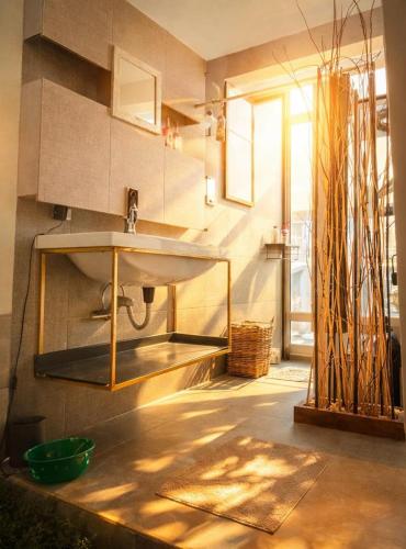 a bathroom with a sink in a room with a window at Amazing View From Los Fuertes in Puebla