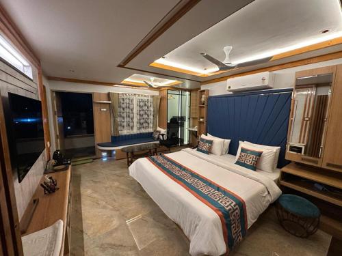 a bedroom with a large bed in a room at The VP Residency Towerrs in Tiruttani