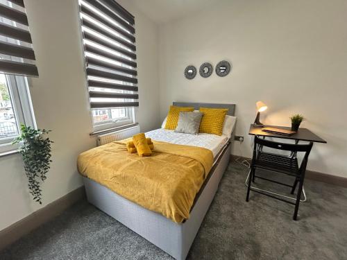 a bedroom with a bed with a teddy bear on it at S5 Private Ensuite Room for Professionals AND contractors LNG Grain digs in Gillingham