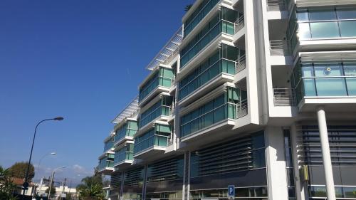 a tall building with balconies on the side of it at Studio Villa Emilie in Cagnes-sur-Mer