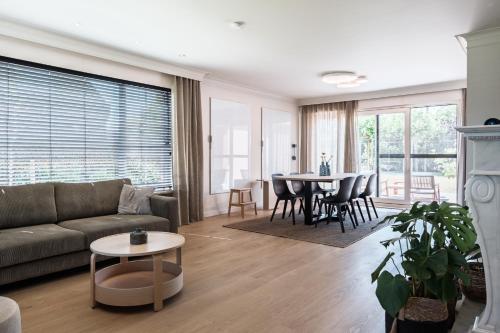 a living room with a couch and a table at roeselare stay in Roeselare