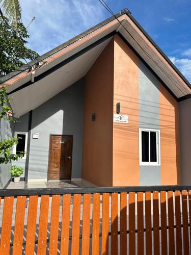 a small house with a brown and white at Family house villa in Ban Rai Yai