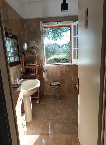 a bathroom with a sink and a window at B&B Antica Neviera in Gioia del Colle