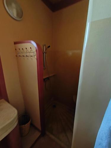 a small bathroom with a shower and a toilet at Auberge Merzane in Merzane