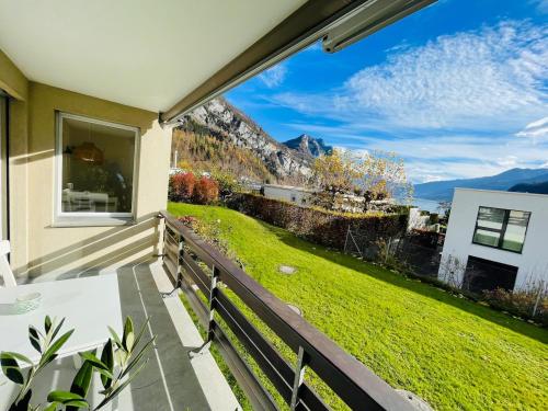 a balcony with a view of a yard at Fli Apartment in Weesen