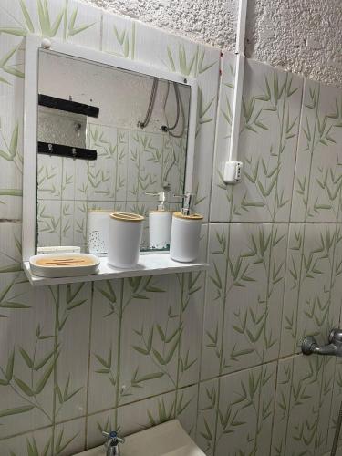 a bathroom with a sink and a mirror on the wall at Inactivo in Chuy