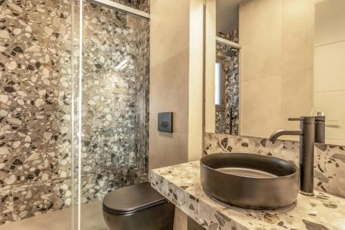 a bathroom with a sink and a shower at G.Living 365 in Agia Effimia