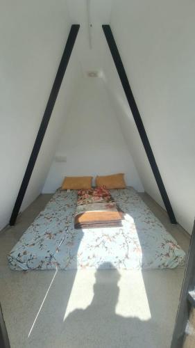 a bed in the attic of a room at Secret valley vattavada in Vattavada