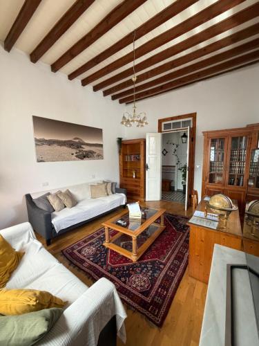 a living room with a couch and a table at Casa Antigua Arona in Arona