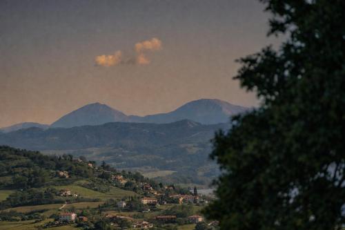 a view of a valley with mountains in the background at Villa Gianotti by MMega in Lugnano