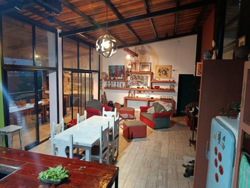 a dining room with a table and chairs in a room at Valle Hermoso Salta in Salta