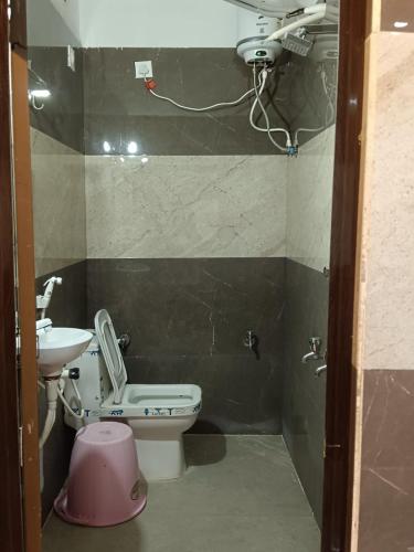 a small bathroom with a toilet and a sink at Ram Hari Hara Convention in Khammam